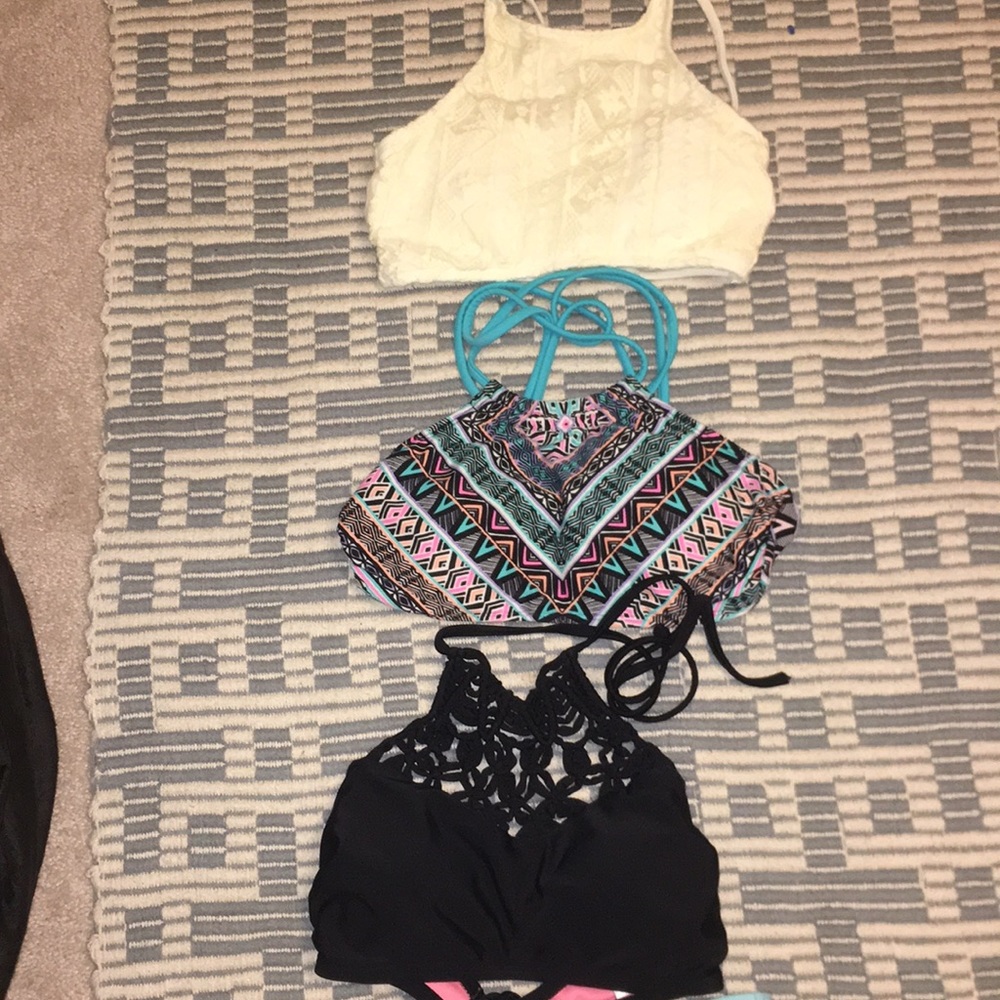 3 bathing suit tops, one pair of bottoms